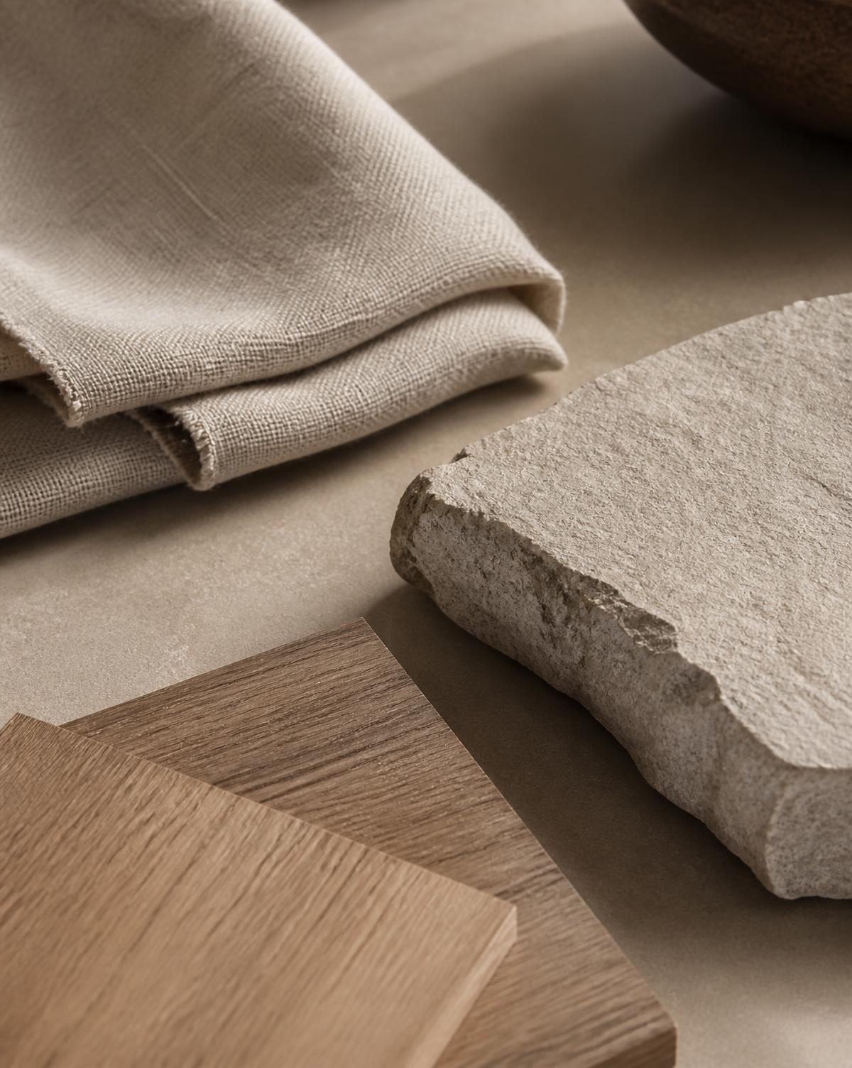 Detalhe de materiais naturais: linho, pedra e madeira